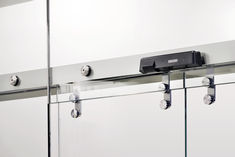 Automatic sliding door drive Slimdrive SL with point-fixed all-glass system (GGS)