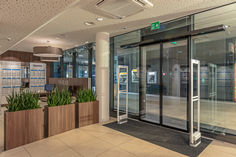 Installation of the automatic sliding door drive Slimdrive SL NT-FR at the railway station of Zurich Oerlikon