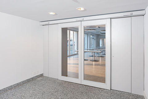 GEZE Slimdrive, the automatic linear sliding door system for escape and rescue routes, in the new extension to the Fux Campagna residential home.