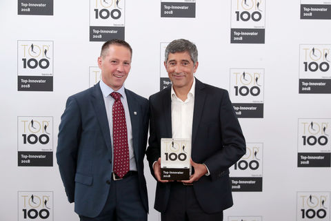 The event rewards Germany's most innovative companies: TOP 100 mentor Ranga Yogeshwar awards the TOP 100 Innovator certificate to GEZE Managing Director Development Gerald Haas. Awards ceremony photos: KD Busch/compamedia