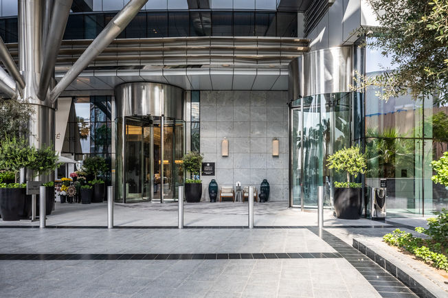 Two revolving doors welcome the guests of the 5-star hotel.