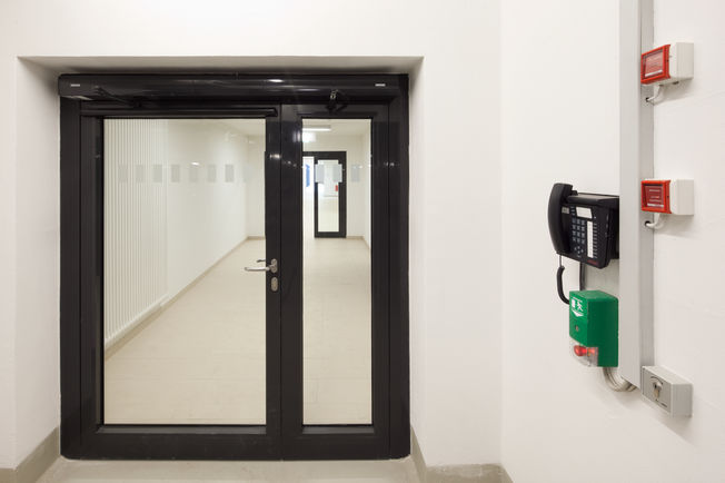 Swing door drive TSA 160 NT F-IS, GC334 sensor strip and the door control unit RWS TZ320 SN surface mounting Swing door drive TSA 160 NT F-IS at a 1-leaf door in the retirement complex of Augustinum, Stuttgart.