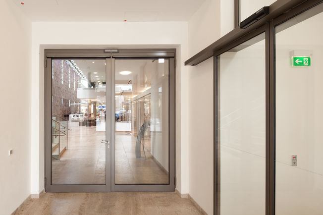 Automatic swing doors are a simple solution for barrier-free access. Existing swing doors can be retrofitted with a drive and the necessary safety devices.