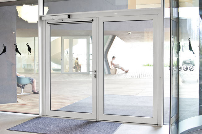 Swing door drive - Slimdrive EMD, Vitra House An electromechanical swing door drive that even moves doors up to 230 kg with ease, allowing visitors convenient ease of access.
