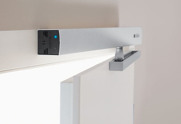 Swing door drive ECturn with guide rail Automatic swing door drive ECturn for barrier-free single leaf doors, electric latching action and obstacle detection detects an obstacle by touch and stops the opening or closing process