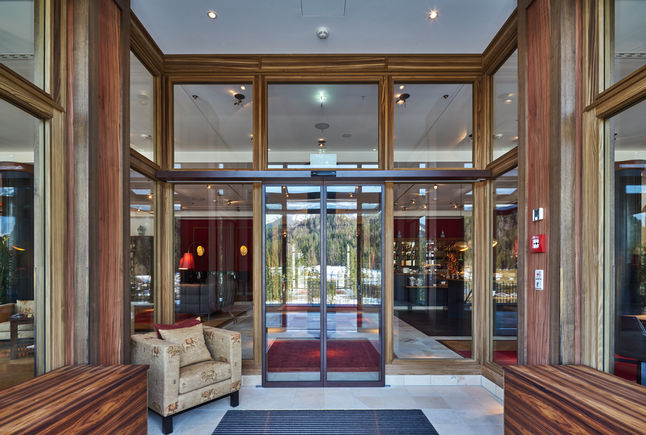 Slimdrive SL NT automatic sliding door drive, installed at Hotel Schloss Elmau Retreat Very smooth, low-wear automatic linear sliding door system with low height and clear design line.