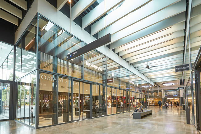 Automatic sliding door drive Slimdrive SL-NT, installed the shopping centre Gelderlandplein in Amsterdam Automatic linear sliding door system with low height and clear design line