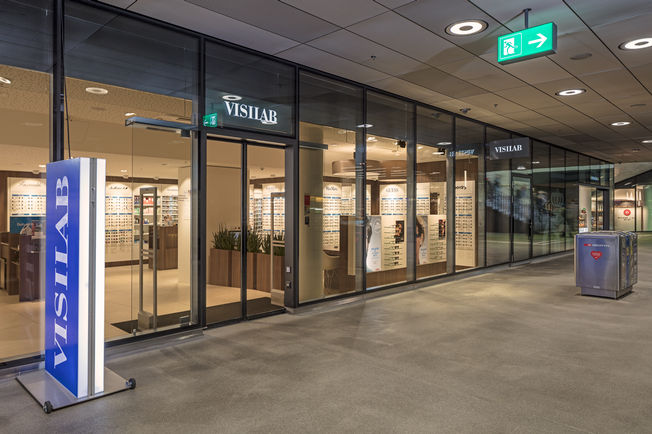 Zürih Oerlikon tren istasyonunda bulunan Slimdrive SL NT-FR otomatik sürgülü kapı motoru montajı Otomatik düz çizgisel sürme kapı sistemi düşük yapı yüksekliğine ve daha net tasarım hattına sahip acil çıkış ve kurtarma yolları