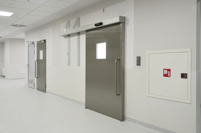 Hygienic Doors at Children's Memorial Health Institute Operating room doors in the corridor of the Children's memorial Health Institute in Warsaw, Poland. Hygienic doors, doorway, window and safety technology for health care, for hospitals.