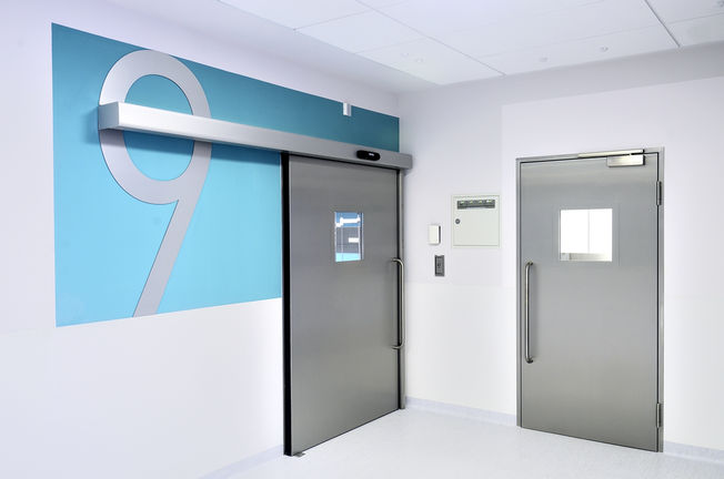 Hygienic Doors at Children's Memorial Health Institute Operating room doors in the corridor of the Children's memorial Health Institute in Warsaw, Poland. Hygienic doors, doorway, window and safety technology for health care, for hospitals.