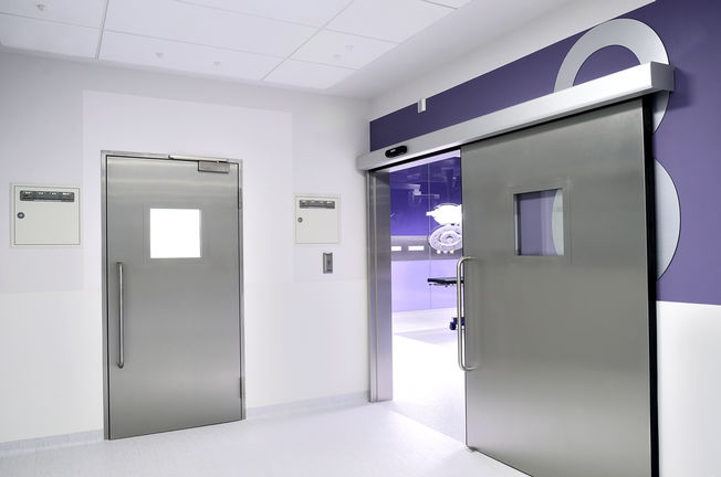 Hygienic Doors at Children's Memorial Health Institute Operating room doors in the corridor of the Children's memorial Health Institute in Warsaw, Poland. Hygienic doors, doorway, window and safety technology for health care, for hospitals.