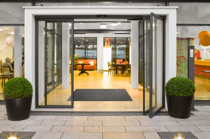 Slimdrive SL-BO in the residential building Automatic sliding door system for emergency exits with break-out function