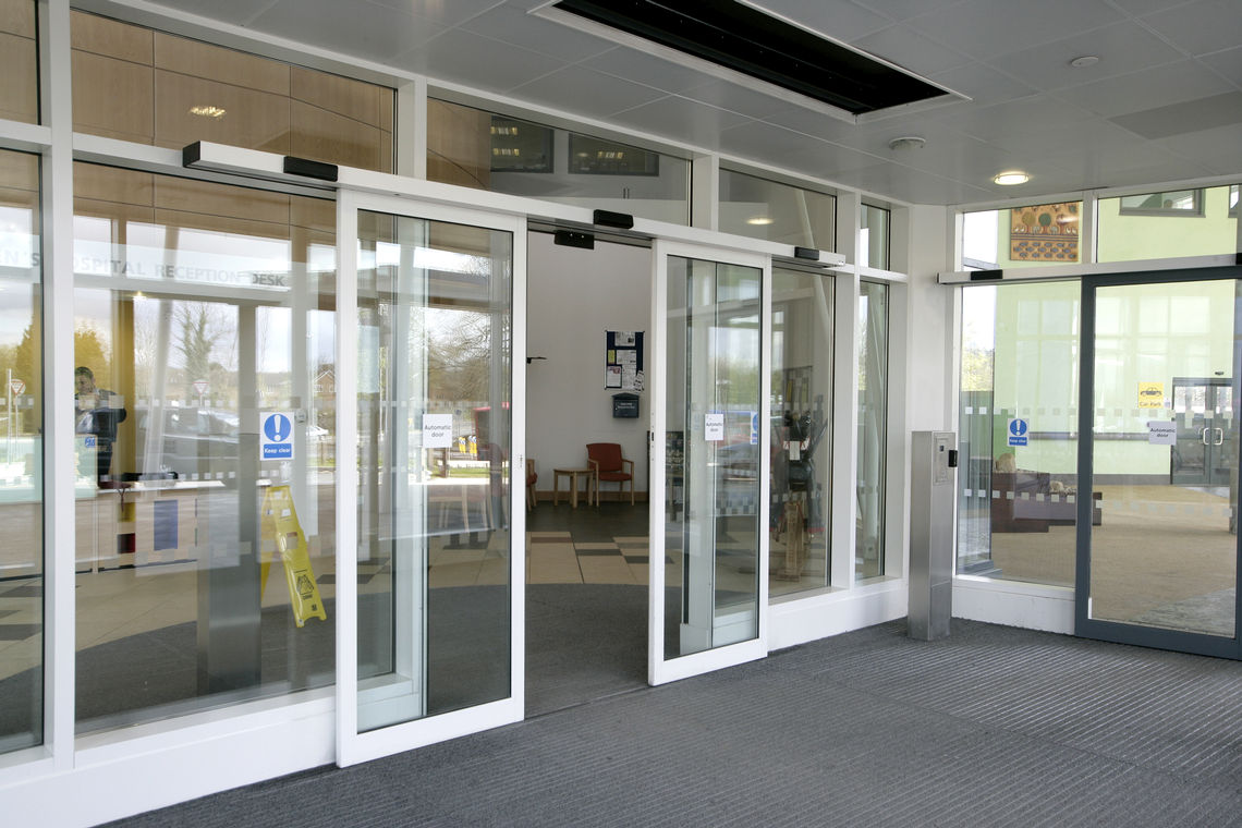 Glazed sliding door systems in the entrance of the children's hospital.