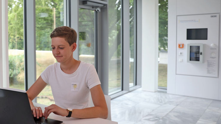 Yvonne Sommerer sits at a laptop