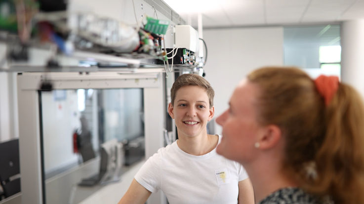 Yvonne Sommerer with a colleague at her daily work