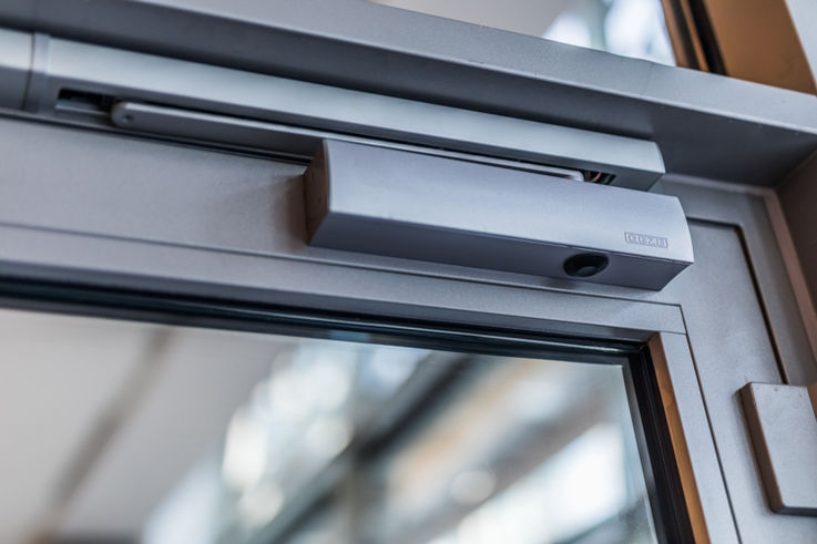 Detailed close-up of GEZE TS 5000 door closer.