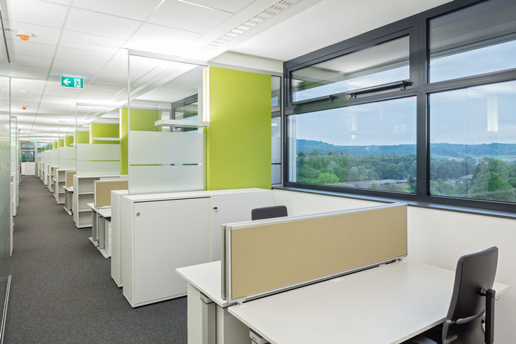 Open-plan offices provide flexible work spaces and short communication channels.