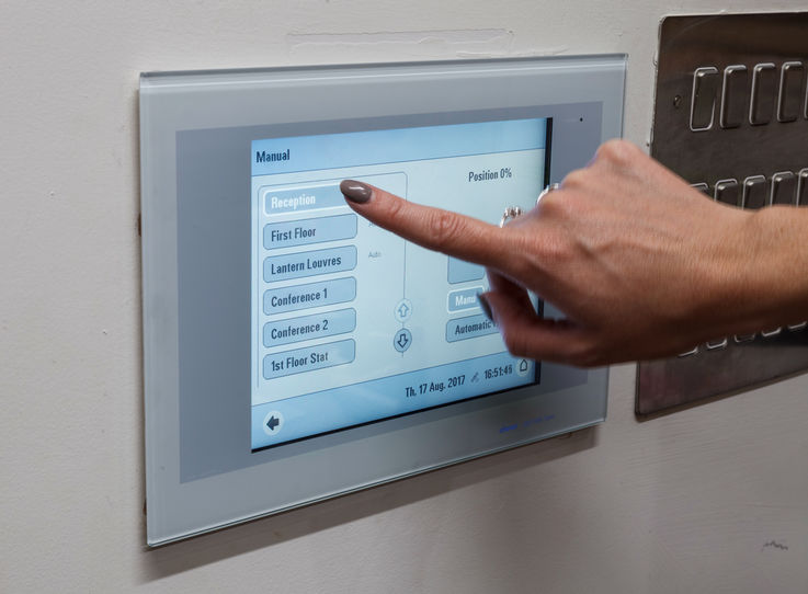 The WS 100 indoor climate building control is connected to a weather station and together they balance internal conditions such as air quality, temperature and humidity with external elements such as rain and wind speeds to achieve desired requirements.