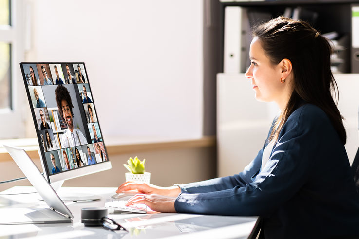 Woman works in home office on laptop